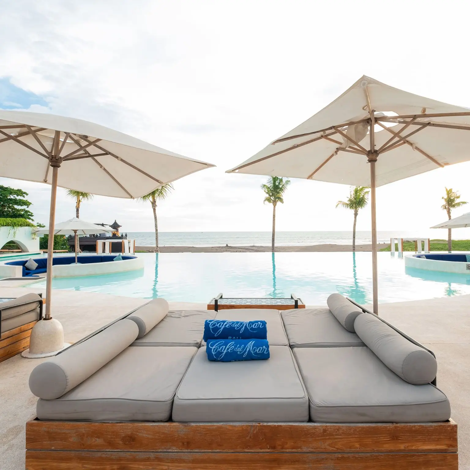 Poolside daybeds overlooking the sea at Café del Mar Bali